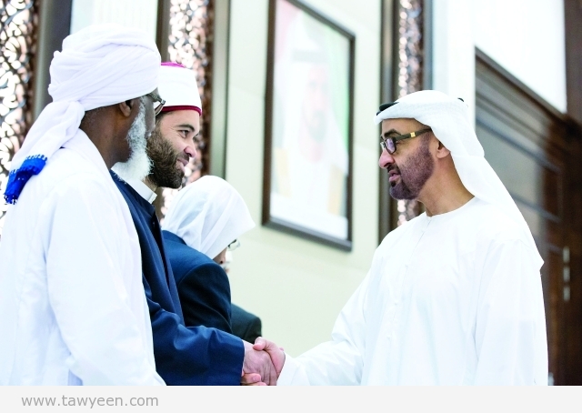 ABU DHABI, UNITED ARAB EMIRATES - June 22, 2015: HH Sheikh Mohamed bin Zayed Al Nahyan Crown Prince of Abu Dhabi and Deputy Supreme Commander of the UAE Armed Forces (R), greets visiting Islamic scholars, at Al Bateen Palace. ( Ryan Carter / Crown Prince Court - Abu Dhabi ) ---