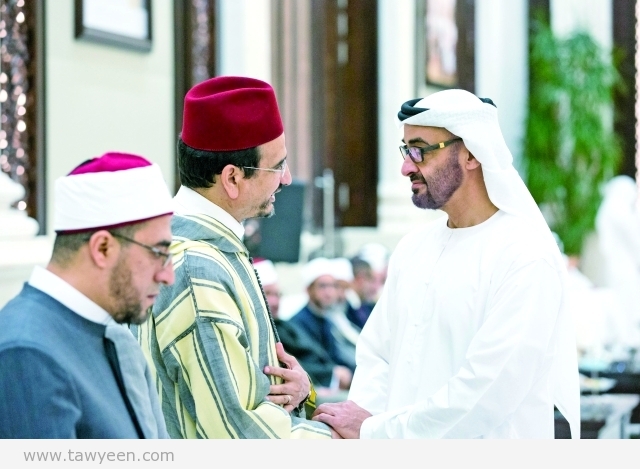 ABU DHABI, UNITED ARAB EMIRATES - June 22, 2015: HH Sheikh Mohamed bin Zayed Al Nahyan Crown Prince of Abu Dhabi and Deputy Supreme Commander of the UAE Armed Forces (R), greets visiting Islamic scholars, at Al Bateen Palace. ( Ryan Carter / Crown Prince Court - Abu Dhabi ) ---
